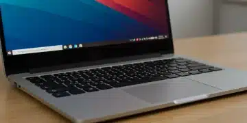 Modern laptop keyboard with clean screen on a wooden desk, symbolizing longevity and care.