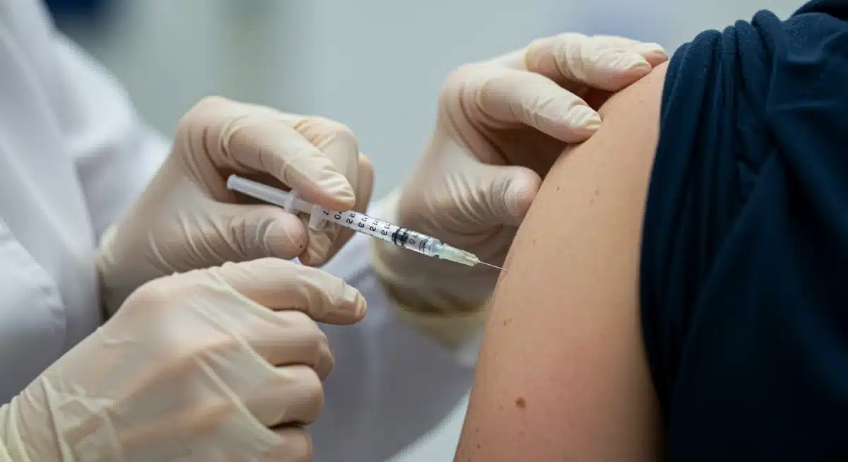 Healthcare professional administering vaccine to patient's arm